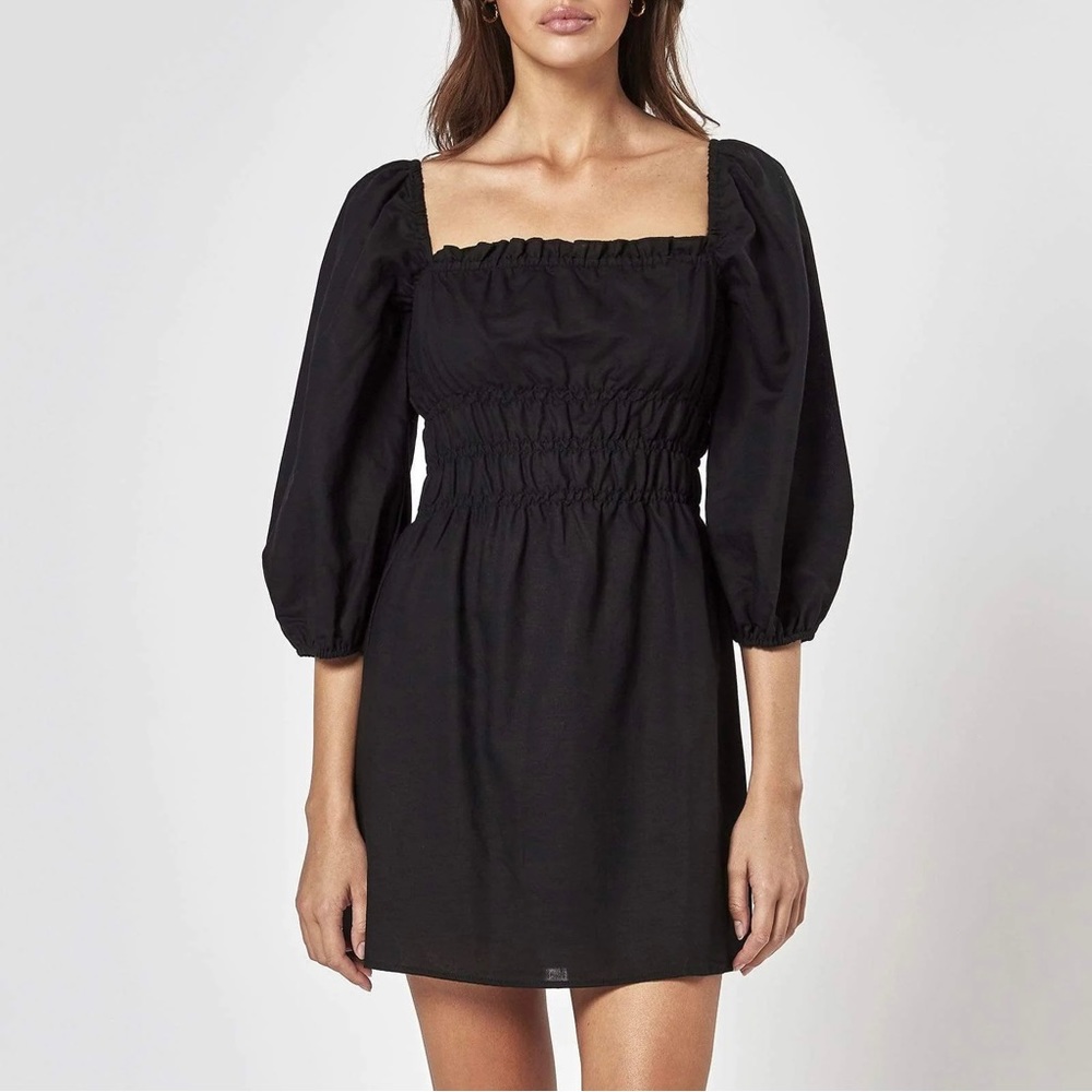 Charlie Holiday Golden State Boheme smocked linen-blend mini dress. 🖤
